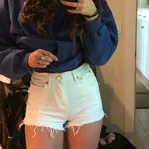 UO High rise white jean shorts
